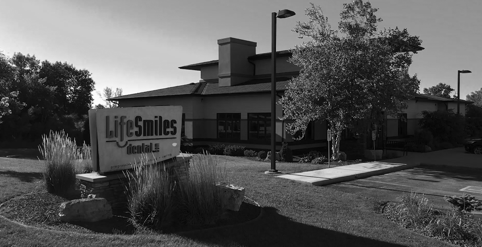 gray-scale image of the outside of the Life Smiles Dental office building