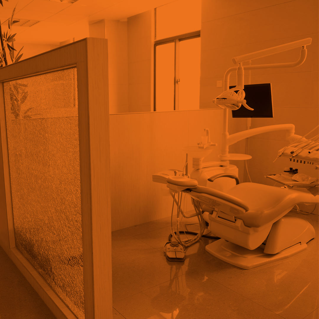 orange-scale image of the interior of an exam room