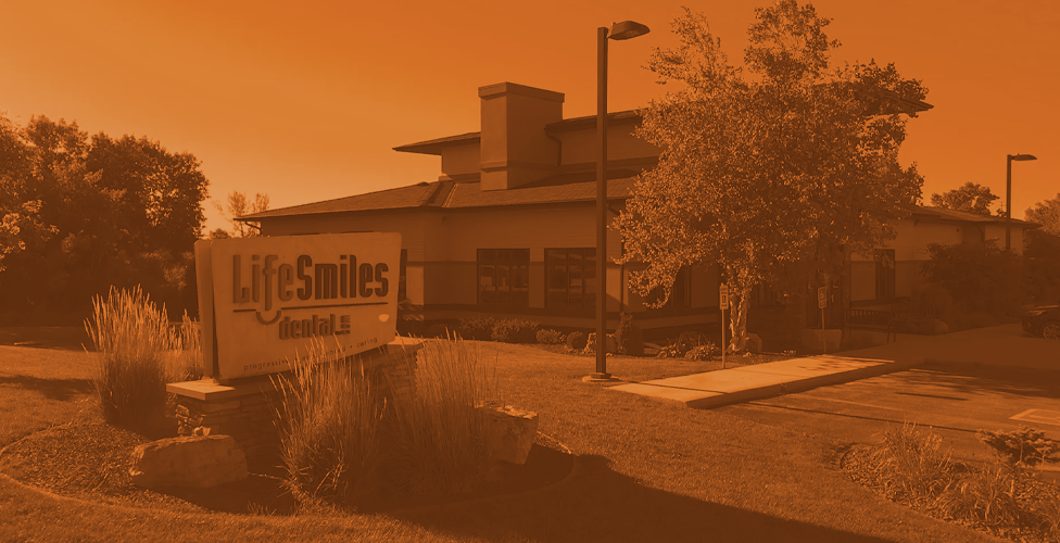 orange-scale image of the outside of the Life Smilies Dental office building